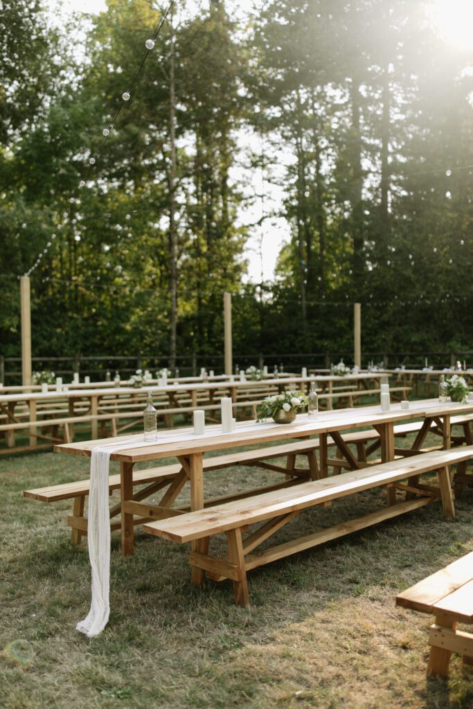 Elegant tablescapes designed by Moriah for her wedding, featuring simple yet perfectly curated decor that blends sophistication with a laid-back picnic vibe