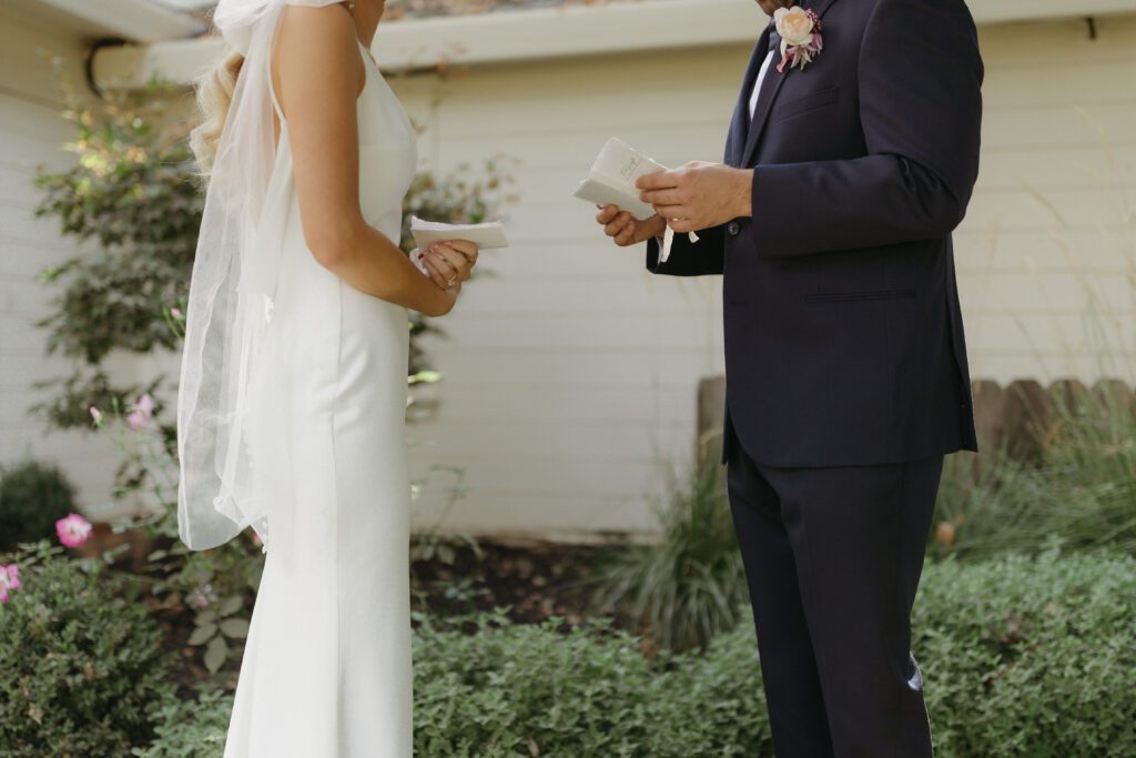 Bride and groom reading heartfelt private vows to each other