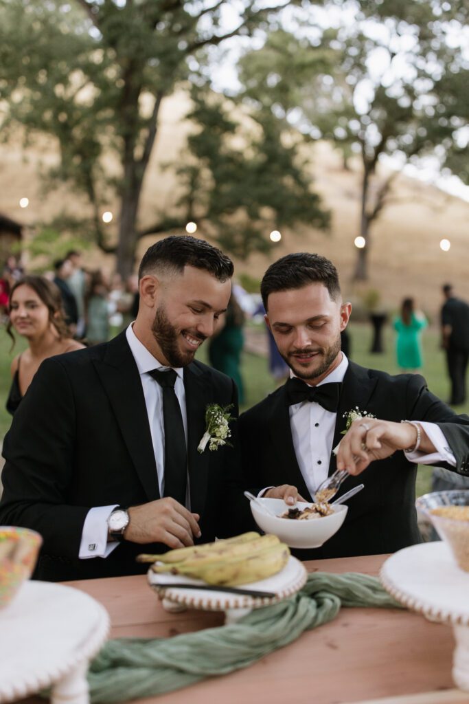 groom and groom first scoop at wedding reception