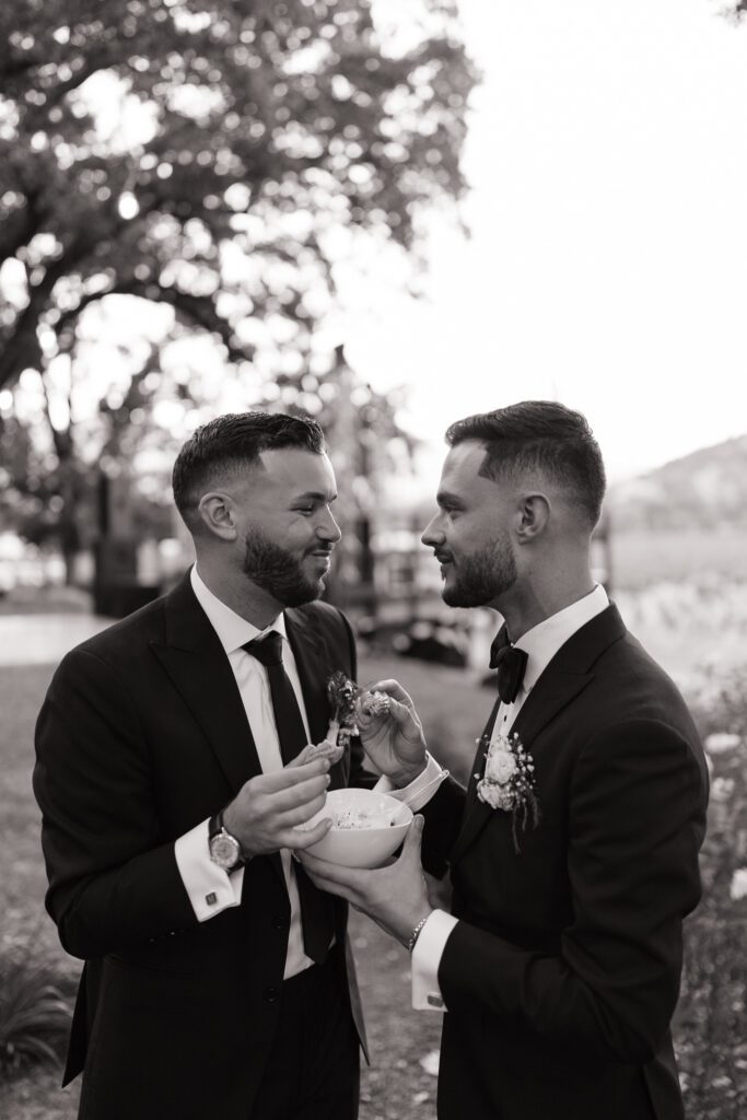 groom and groom eat ice cream at wedding reception