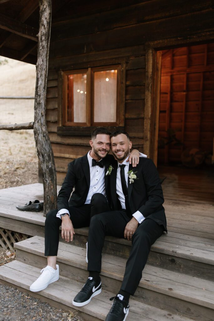 grooms smile for photo, shoe change