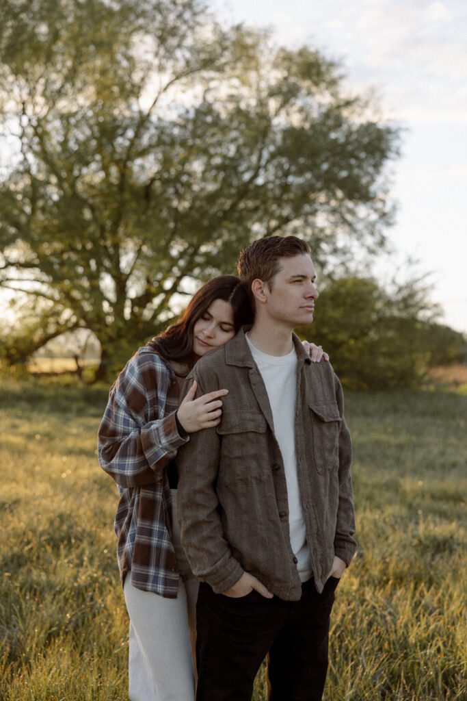 couple in complimentary outfits, not matching, for their engagement photos in Boise
