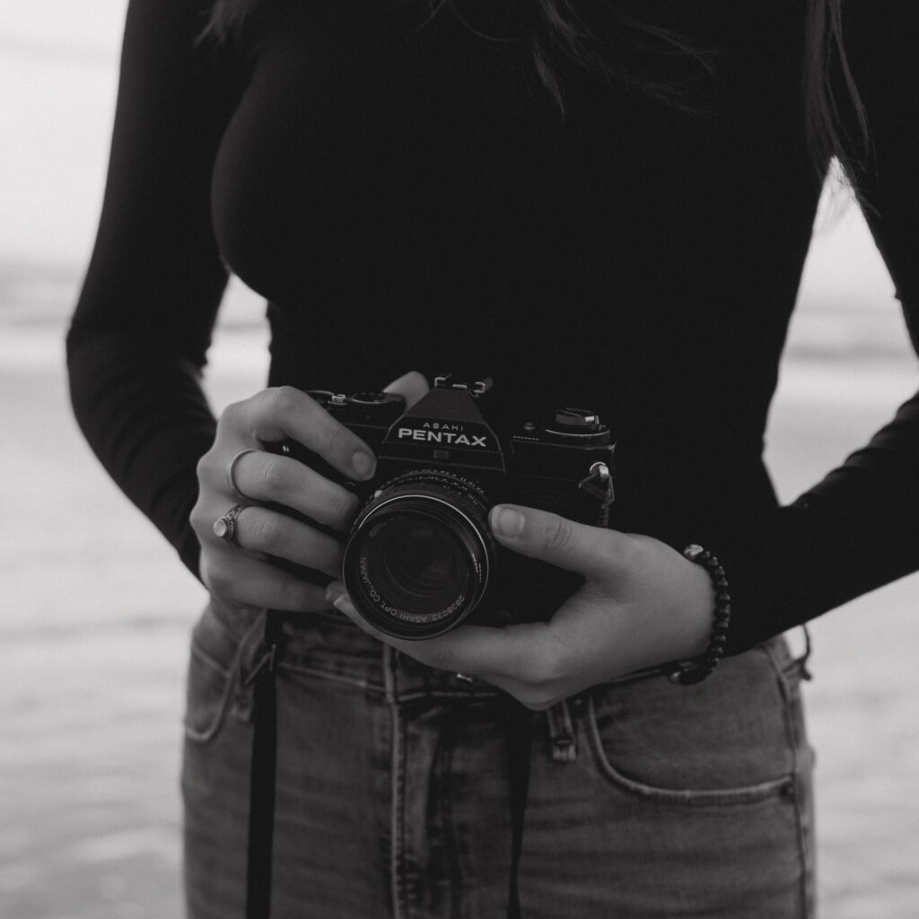 photographer holding film camera