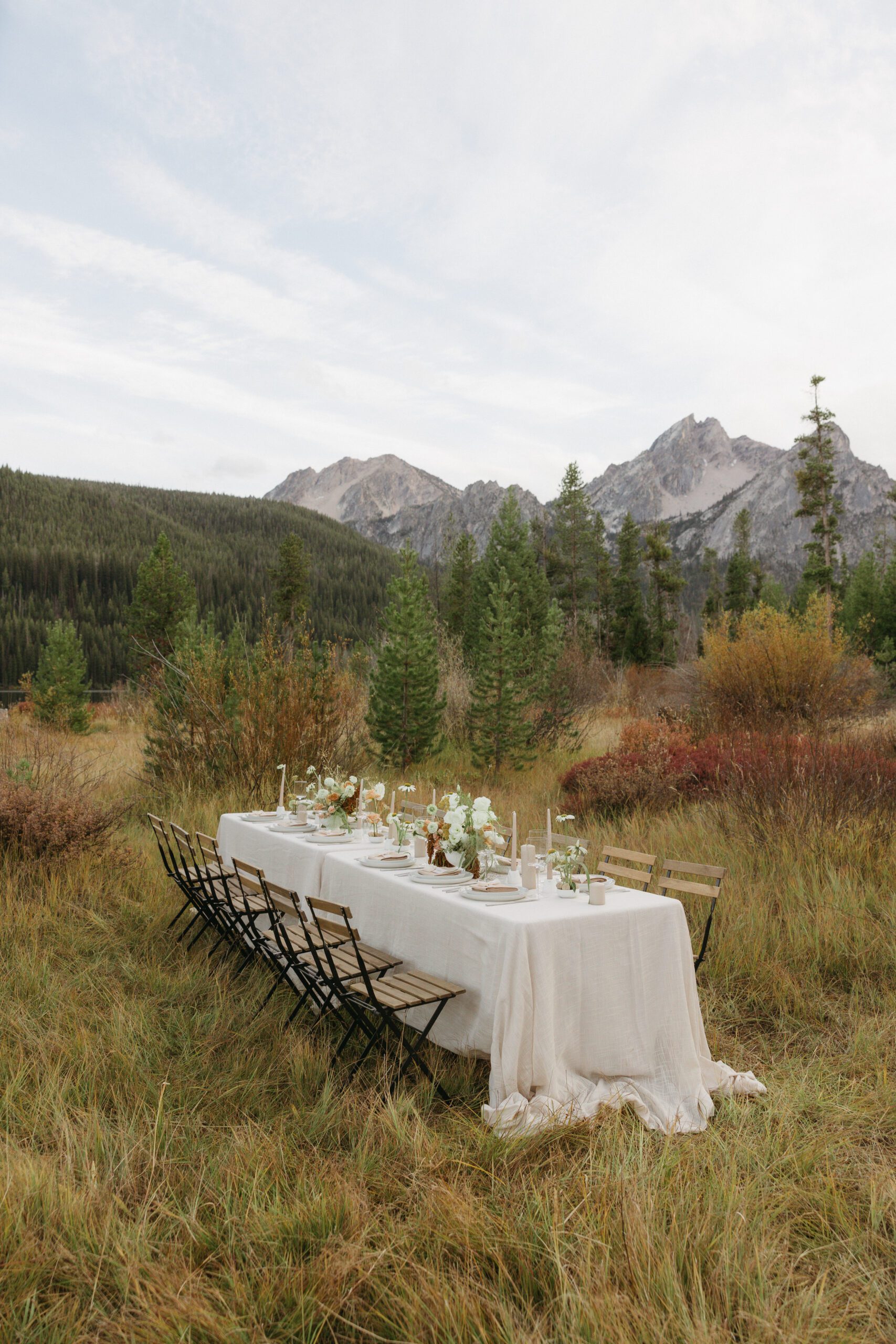 Intimate reception table tucked privately into a meadow in the Sawtooth Mountains.