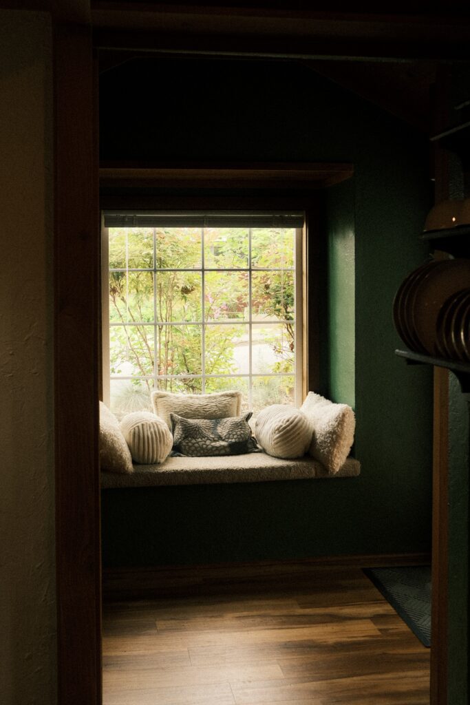 Reading bench in intimate cottage during Oregon elopement.