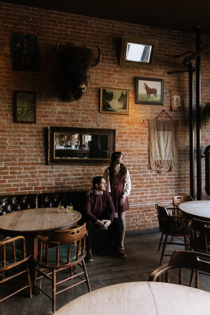 Editorial engagement photos inside Pengilly Saloon in Downtown Boise.