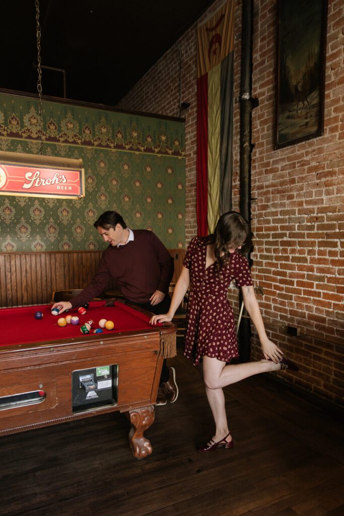 Candid engagement photos inside Pengilly's Saloon in downtown Boise.