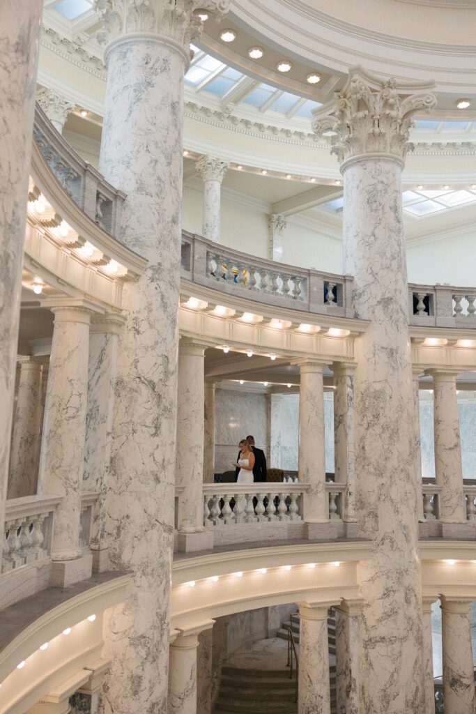 Bride and groom exchanging vows during an intimate Boise Capitol elopement.