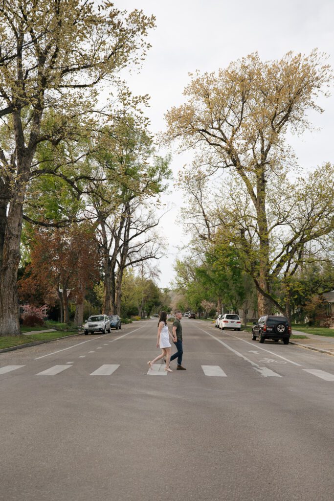 Couple walking through downtown Boise during their engagement session.