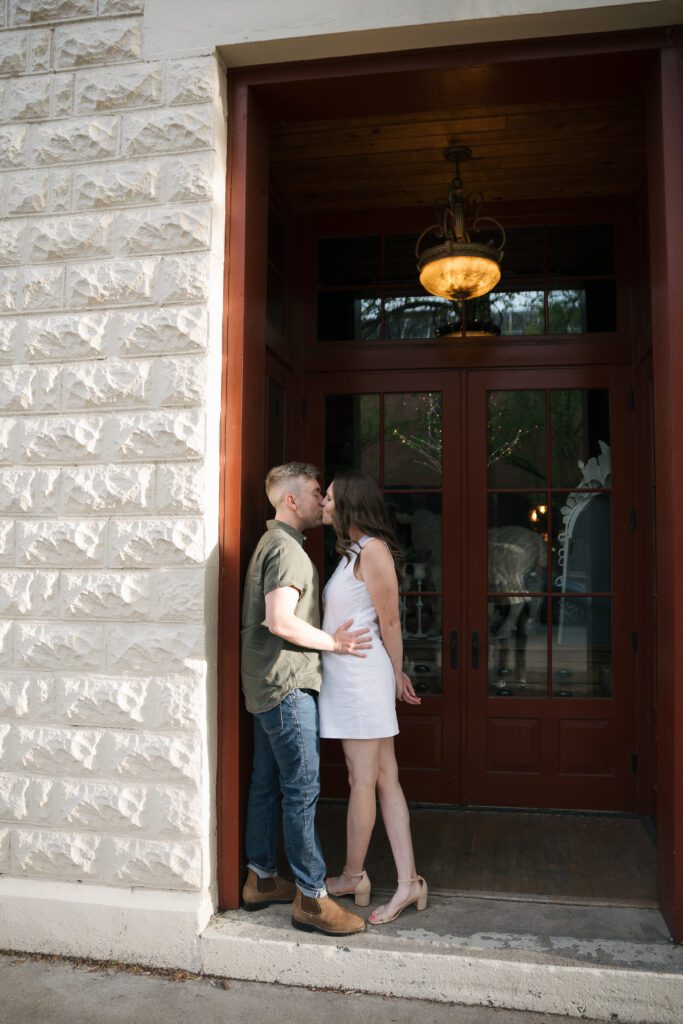 Couple laughing together while exploring downtown Boise at sunset.