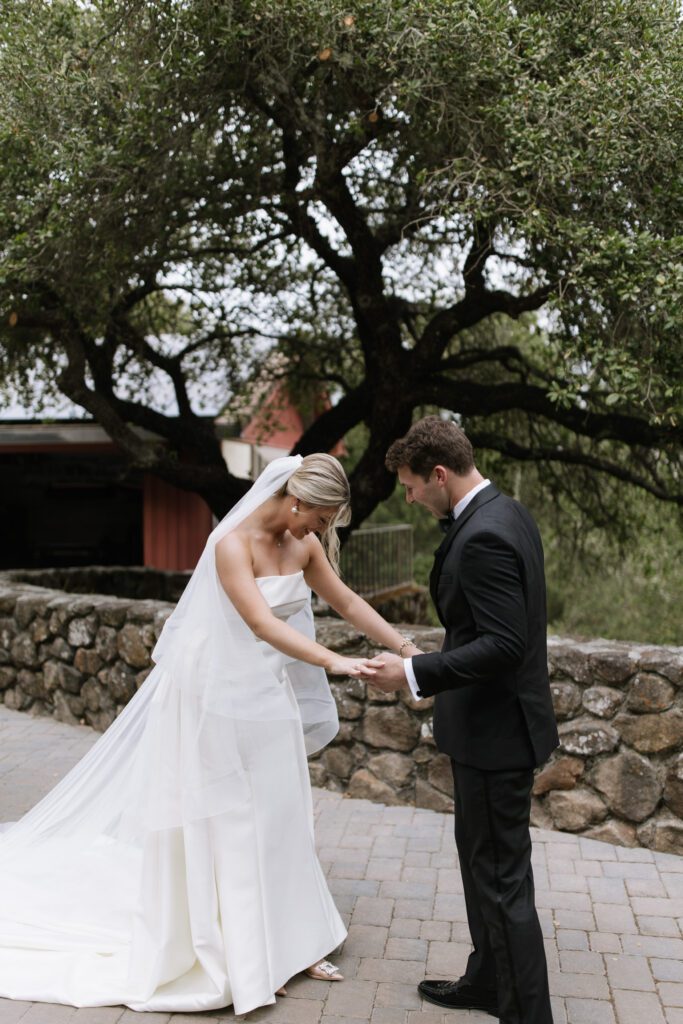 Bride and groom embracing at the end of their wedding celebration