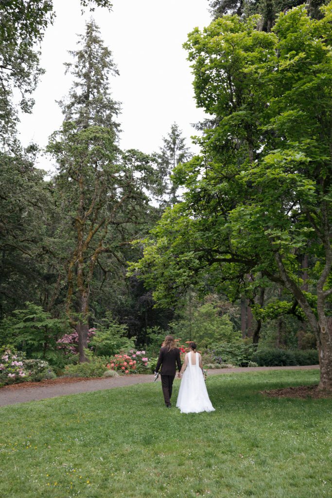 Bride and groom hiking together after their Oregon elopement ceremony.