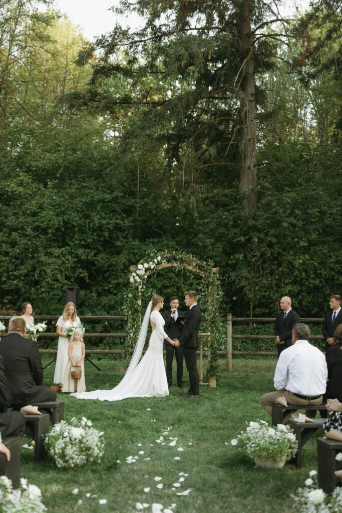 Bride and groom exchange vows during wedding ceremony in Washington.