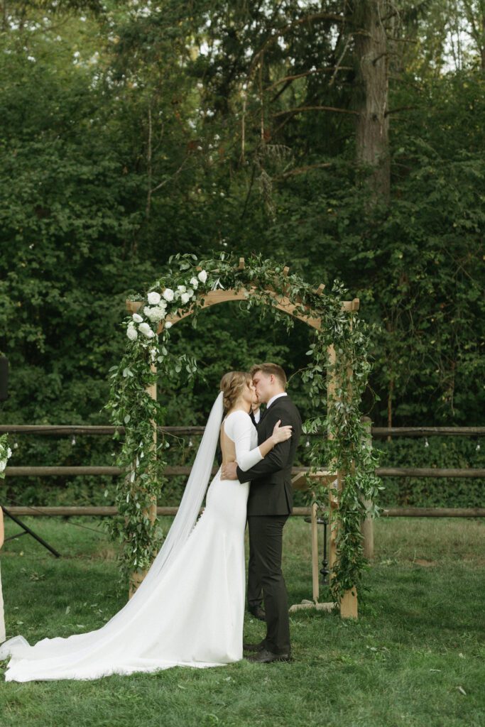 Bride and groom embrace after ceremony in Vancouver, Washington