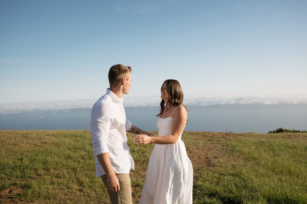Couple smiling together while walking through Mount Tamalpais State Park.