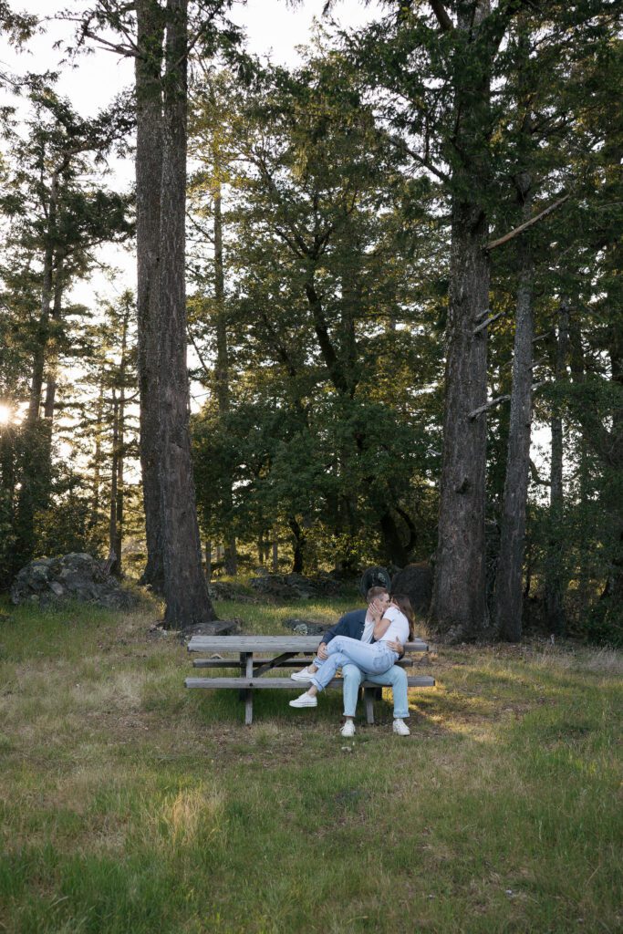 Couple embracing during sunset engagement photos at Mount Tamalpais.
