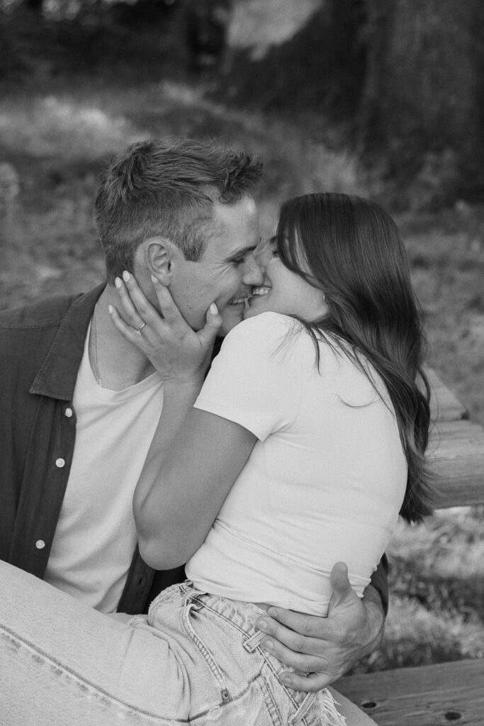 Couple share a kiss during engagement photos at Mount Tamalpais.