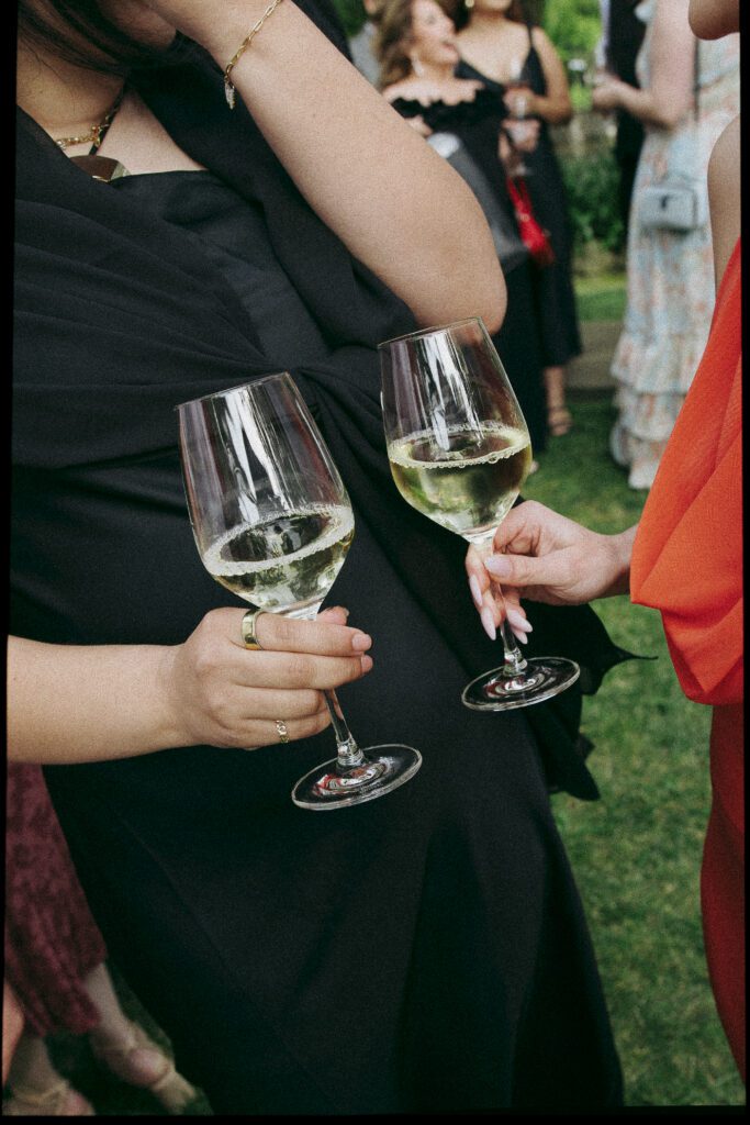 Guests cheers champagne during wedding reception at Cline Cellars in Sonoma.