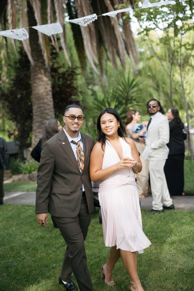 Guests smile for photos during cocktail hour at Cline Cellars wedding venue.