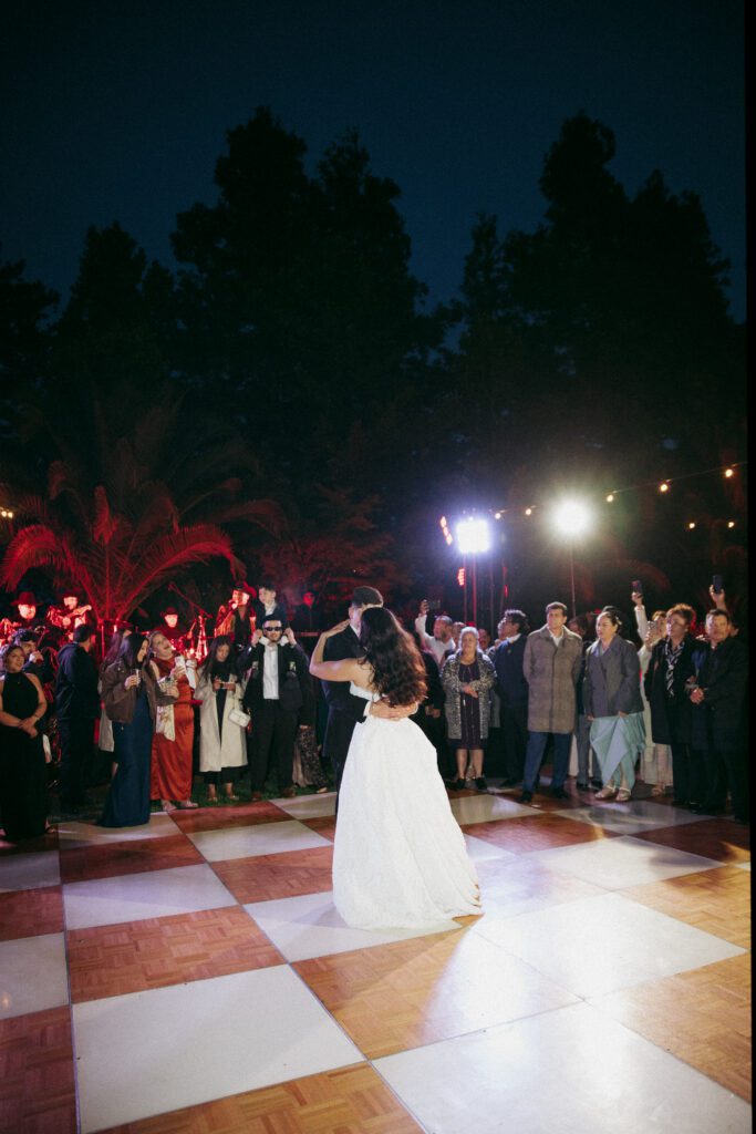 Bride and groom first dance together during their luxury wedding at Cline Cellars in Sonoma.