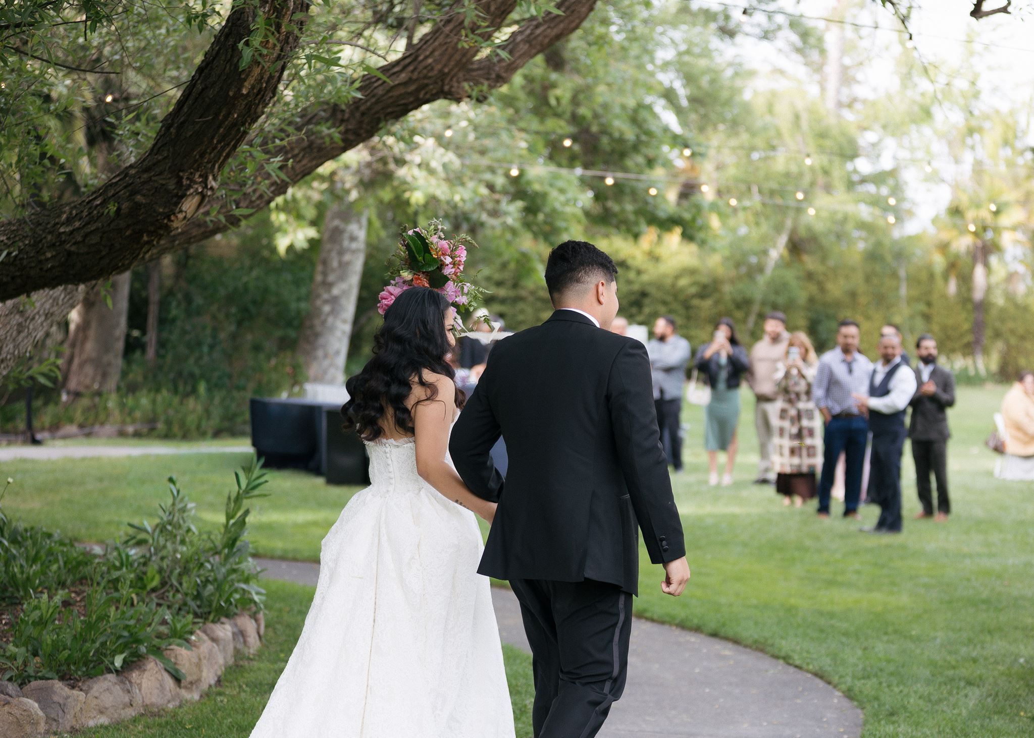 Bride and groom enter wedding reception together.